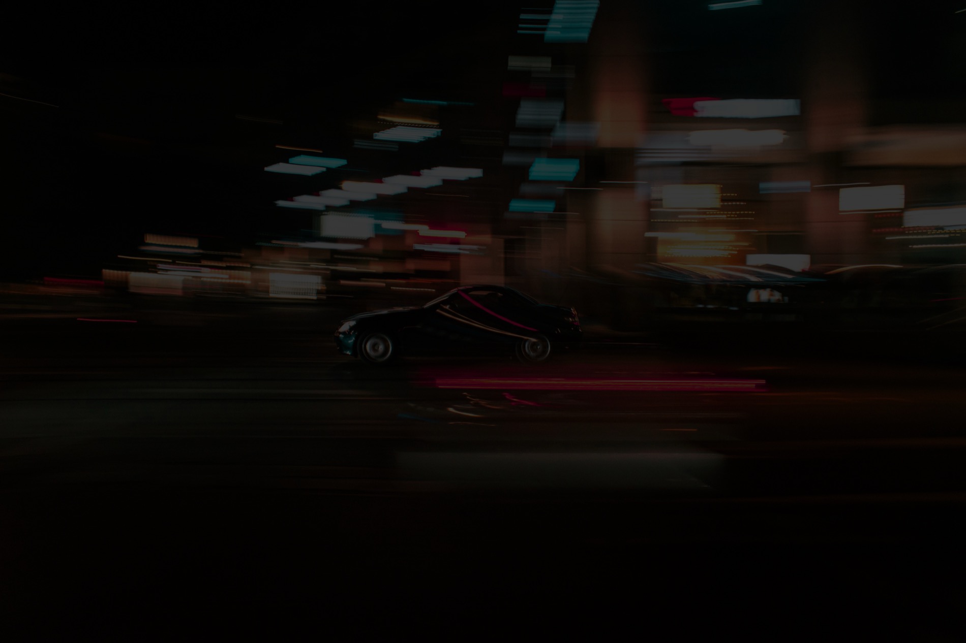Luxury car at night with tinted windows